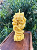Hand Holding Skull Candle