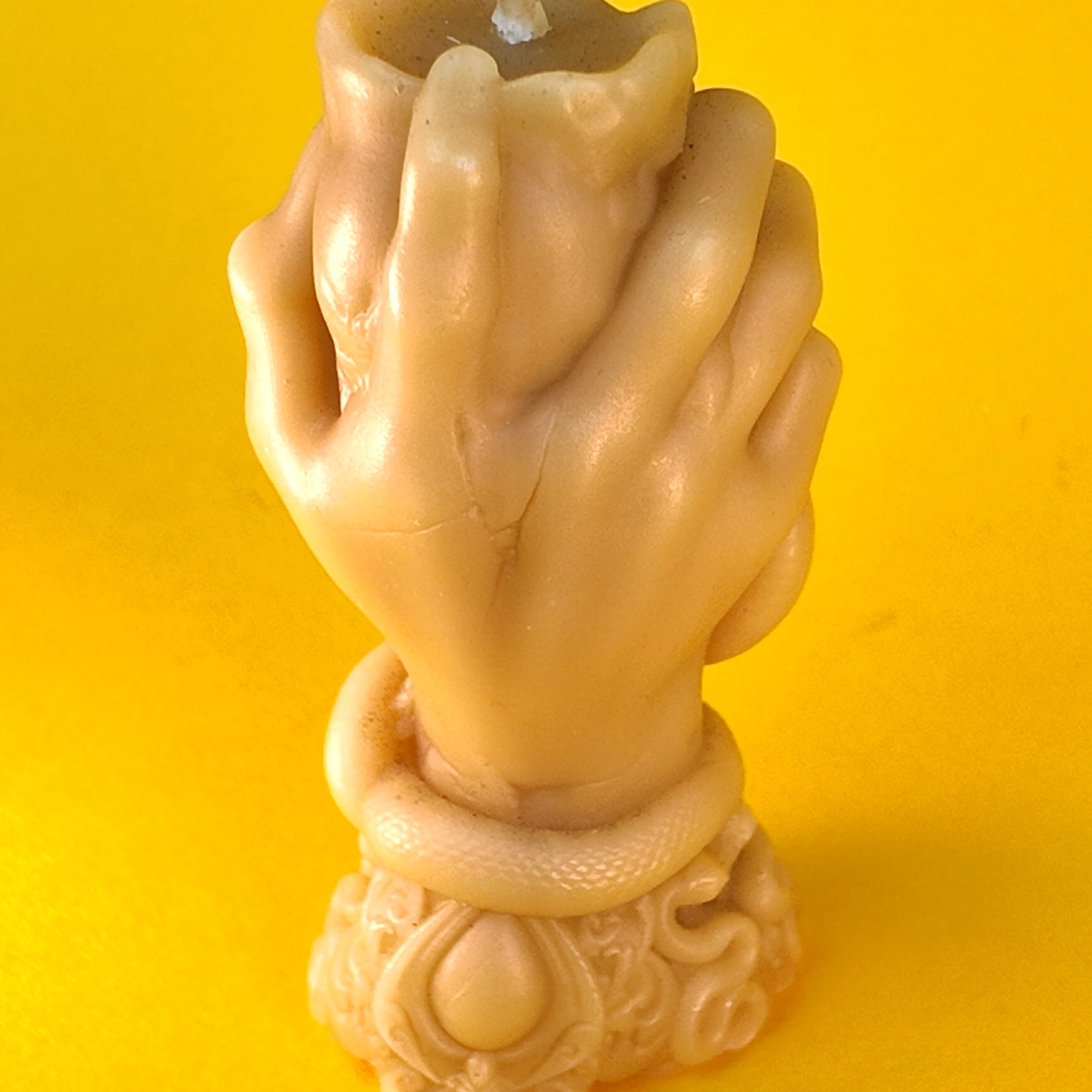 Hand Holding Skull Candle
