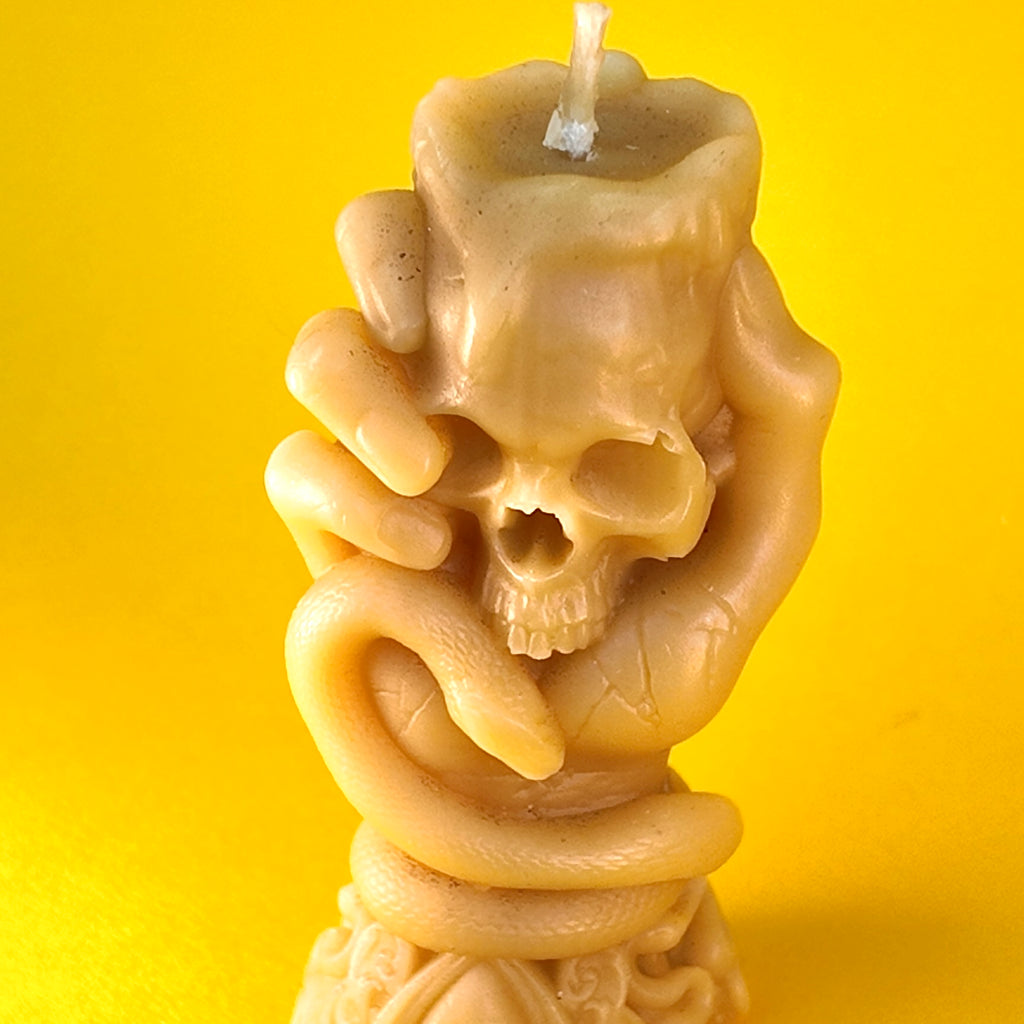 Hand Holding Skull Candle